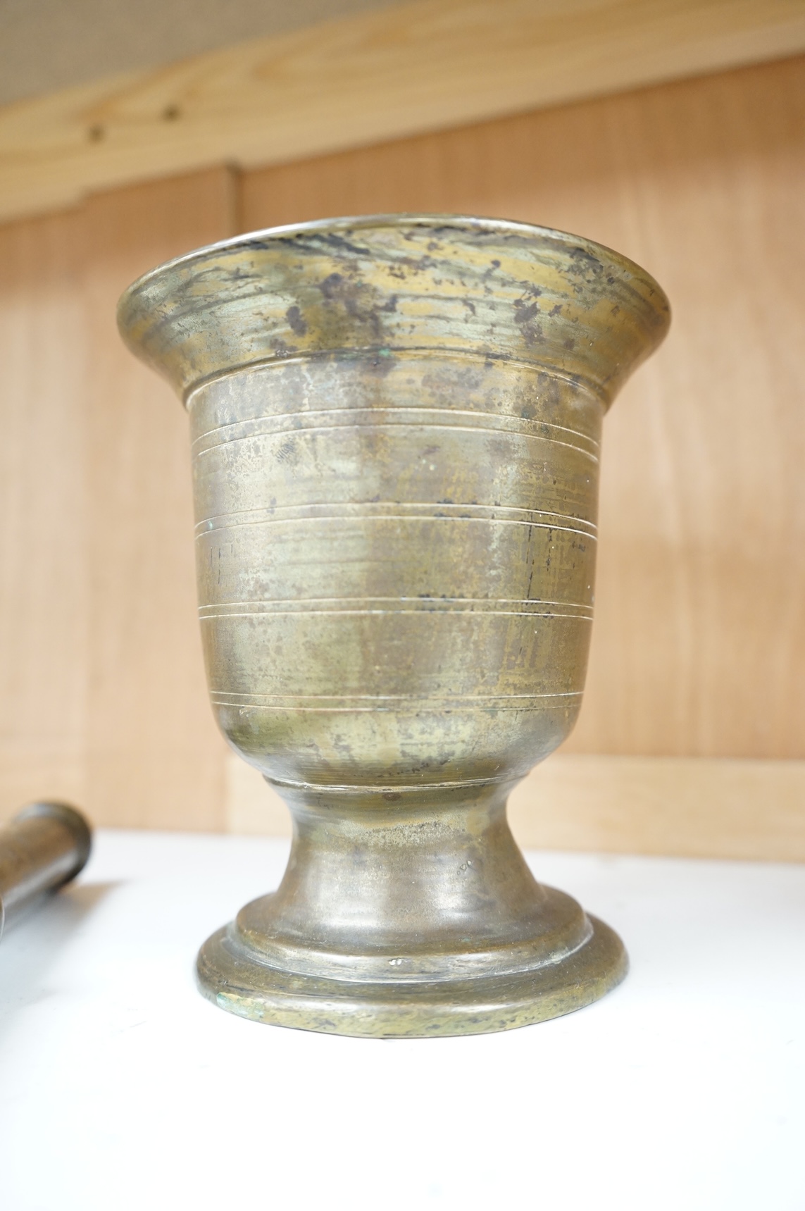 A Victorian bronze pestle and mortar, 25cm in length